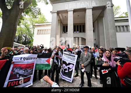 Venedig, Italy. 17th Apr, 2024. Demonstrators with Palestinian flags protest at the pre-opening in the Giardini on the grounds of the Art Biennale in Venice. The Biennale Arte opens on 20.04.2024 and runs until 24.11.2024. Credit: Felix Hörhager/dpa/Alamy Live News Stock Photo