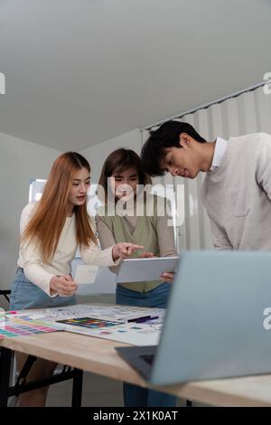 Brainstorm team of creative web graphic designer planning. Creative designers present ux ui to team. Designers team working meeting in office Stock Photo