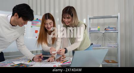 Brainstorm team of creative web graphic designer planning. Creative designers present ux ui to team. Designers team working meeting in office Stock Photo