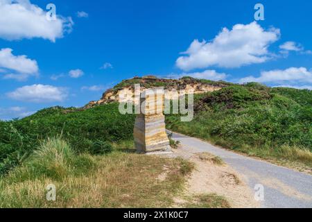 Hengistbury Head, UK - July 1st 2023: The rammed earth sculpture sculpture Layers of Bournemouth by Briony Marshall. Stock Photo