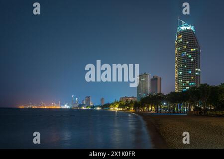 Night view of a beautiful beach in Pattaya, Thailand with highrises and city lights in background Stock Photo