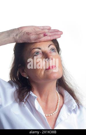 Studio shot of an expressive senior female cut out against a white background - John Gollop Stock Photo
