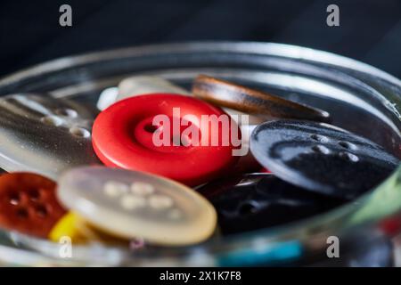 Assorted Sewing Buttons with Cinnamon in Glass Jar, Macro Close-Up Stock Photo