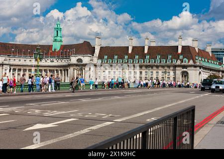 London, United Kingdom - June 29, 2010 : Westminster Bridge. Crowds crossing River Thames in front of County Hall to and from Parliament Square. Stock Photo