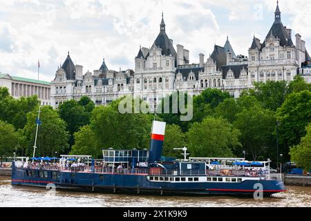 London, United Kingdom - June 29, 2010 : Tattershall Castle . Floating pub on River Thames in front of The United Nations UK building. Stock Photo