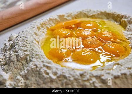 Fresh Eggs and Flour for Pasta Making, Close-Up Perspective Stock Photo