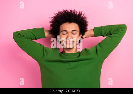 Photo of calm peaceful guy hands over head sleep isolated pastel color background Stock Photo