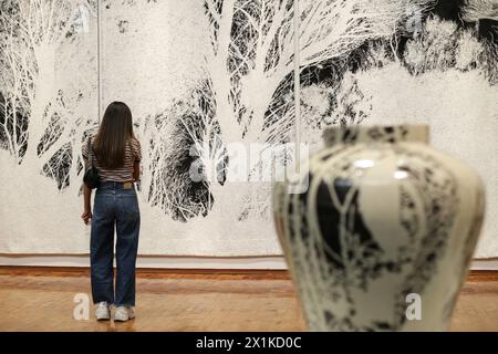 Mexico City, Mexico. 16th Apr, 2024. A woman visits the Atlas exhibition by artists Jan Hendrix of the Netherlands at the Citibanamex Culture Palace, in Mexico City, Mexico, on April 16, 2024. Credit: Francisco Canedo/Xinhua/Alamy Live News Stock Photo