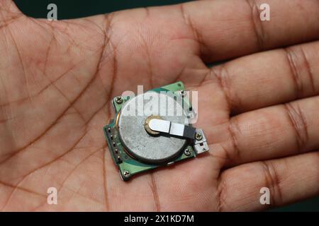 Brushless dc motor of outdated type that was used in printers held in the hand. Very old electronic components Stock Photo