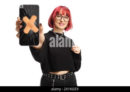 Young female holding a smartphone with a broken screen fixed with adhesive tape isolated on white background Stock Photo