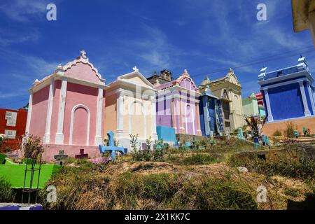 The colorful tombs and vaults of the Cementerio General in Chichicastenango, Guatemala. According to indigenous Maya tradition, the colorful burial site honors the dead and encourages the living to make peace with death. Stock Photo