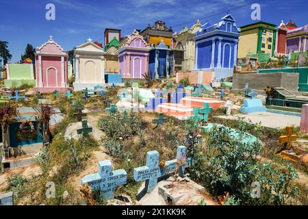 The colorful tombs and vaults of the Cementerio General in Chichicastenango, Guatemala. According to indigenous Maya tradition, the colorful burial site honors the dead and encourages the living to make peace with death. Stock Photo