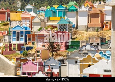 The colorful tombs and vaults of the Cementerio General in Chichicastenango, Guatemala. According to indigenous Maya tradition, the colorful burial site honors the dead and encourages the living to make peace with death. Stock Photo