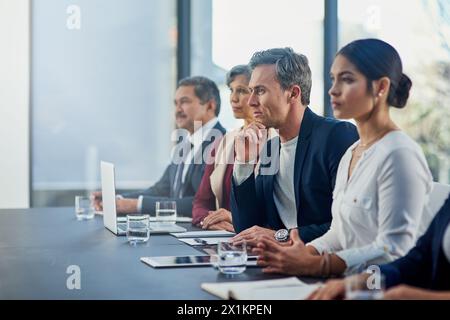 Meeting, technology and business people in office for teamwork or collaboration on finance project. Discussion, diversity and group of financial Stock Photo