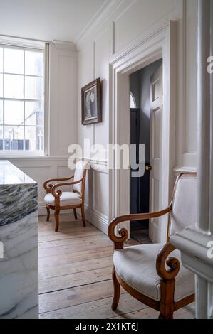 Pair of vintage wooden armchairs in stylish Georgian townhouse, Greenwich, London, UK Stock Photo