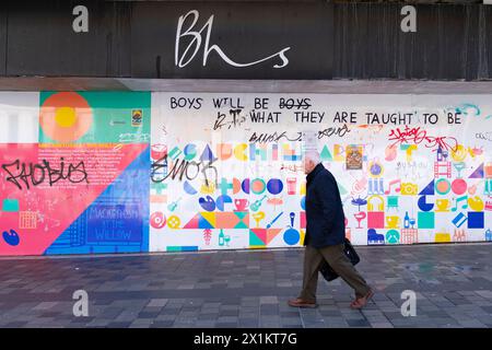 Member of pubic walks past boarded up BHS store on Sauchiehall Street in Glasgow, Scotland Uk Stock Photo