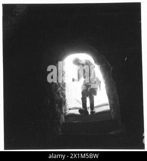 THE POLISH ARMY IN THE SIEGE OF TOBRUK, 1941 - Soldier entering headquarters of the Polish Independent Carpathian Rifles Brigade placed in a big underground cave, Polish Army, Polish Armed Forces in the West, Independent Carpathian Rifles Brigade, Rats of Tobruk Stock Photo