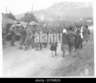German and Italian prisoners are escorted by a British soldier at ...