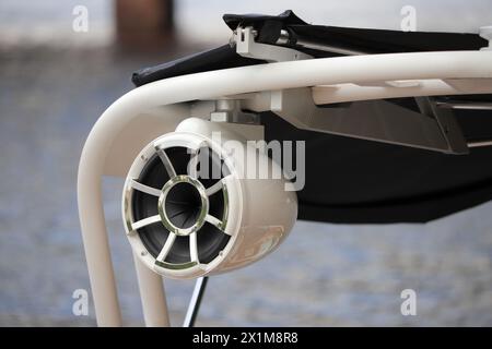 Hanging audio speaker on a motorboat close-up Stock Photo