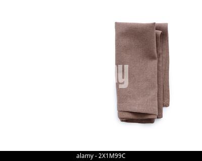 Flat lay with brown linen kitchen napkin isolated on white background. Folded cloth for mockup Stock Photo