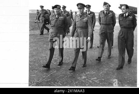 H.M. THE KING IN HOLLAND - His Majesty the King, the Commander-in-Chief, Air-Marshal Conningham and Air-Vice Marshal Broadhurst seen walking to the Cars, British Army, 21st Army Group Stock Photo