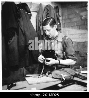 THE ACTIVITIES OF THE ROYAL ELECTRICAL AND MECHANICAL ENGINEERS - Craftsman Graves of Manahester is here seen doing much the same work as he was as a civilian. He is repairing binocular cases, British Army Stock Photo
