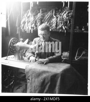THE ACTIVITIES OF THE ROYAL ELECTRICAL AND MECHANICAL ENGINEERS - Frank Johnson of Bangor, Co.Down, is an ex-serviceman who was with the RFA from 1914 to 1919. Here he is stitching gun covers, British Army Stock Photo