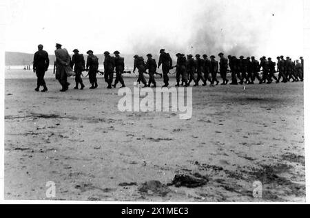 British troops undergo gun drill training on a captured German gun ...
