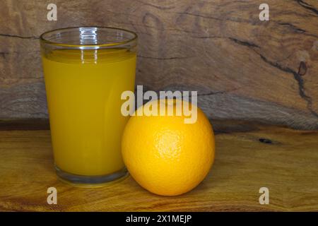 Valencia Orange Fruit With Glass Of Juice (Citrus x sinensis) Stock Photo