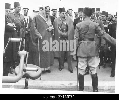 KING IBN SAUD SEES EGYPT'S MILITARY MIGHT - The two Kings show keen interest in a demonstration of heavy ack-ack artillery, Stock Photo