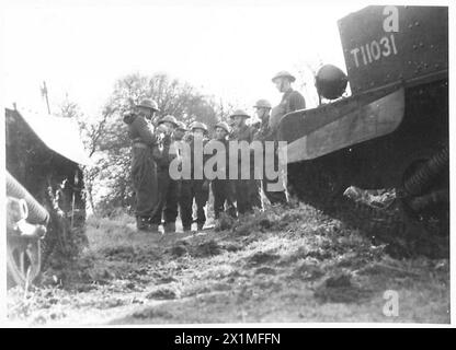 BREN CARRIERS IN ACTION - The crews receiving instruction before the exercise , British Army Stock Photo