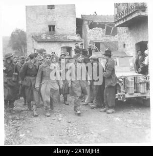 German prisoners are escorted by British Army personnel following a ...