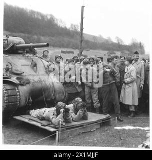 ALLIED COMMANDERS VISIT BRITISH AND AMERICAN TROOPS - General Eisenhower and Air Chief Marshal Sir Arthur Tedder watching tank firing at Warminster Barracks miniature range [33rd Armoured Division], British Army Stock Photo