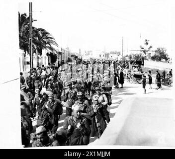 Thousands of Italian soldiers are marched to a prisoner-of-war camp ...