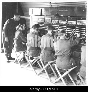 Royal Corps of Signals operators work at receiving sets in a wireless ...
