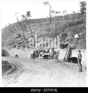 ITALY : EIGHTH ARMYINDIAN SECTOR - The area in front of the Ortona-Orsogna road. Indian Medical Service men, waiting for casualties use roadside culverts for precautionary cover against shellfire, British Army Stock Photo