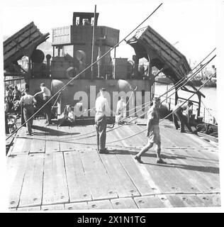 ON BOARD AN AFRICAN BOUND SHIP IN CONVOY - Royal Engineers uncovering hatches, British Army Stock Photo