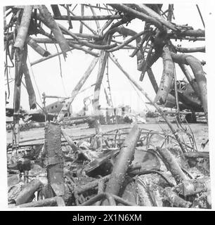 TUNIS AIRPORT : ANOTHER GRAVEYARD OF GOERING'S LUFTWAFFE - The great damage to the hangars of the airport completely gutted and useless, British Army Stock Photo