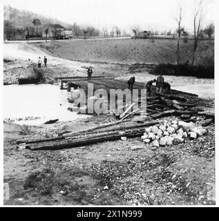 ITALY : AUTUMN FLOODS CAUSE ROAD DAMAGE - Causeway in 20714 being dismantled. Showing decking of rail sections, British Army Stock Photo