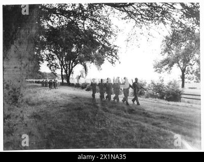 YORK AND LANCASTER REGIMENT IN TRAINING - An outpost takes cover by the ...