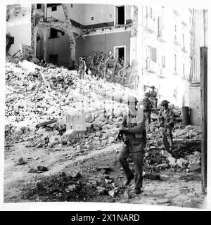 ITALY : FIFTH ARMYBRITISH TROOPS OCCUPY TEANO - A civilian prepares ...