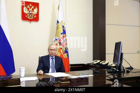 Novo-Ogaryovo, Russia. 17th Apr, 2024. Russian President Vladimir Putin hosts a remote meeting via video conference with with members of the government from the Novo-Ogaryovo state residence, April 17, 2024 in Moscow Oblast, Russia. Credit: Gavriil Grigorov/Kremlin Pool/Alamy Live News Stock Photo