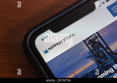 Website of Nippon Steel seen in an iPhone. Nippon Steel Corporation is Japan's largest steelmaker, headquartered in Chiyoda-ku, Tokyo Stock Photo