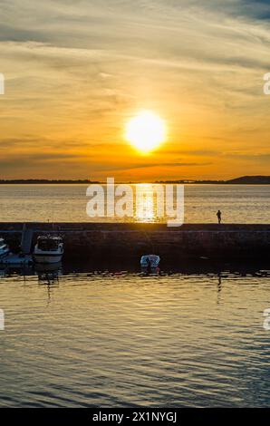 Beautiful sunset over the sea, seen from the port of Alesund, Norway Stock Photo