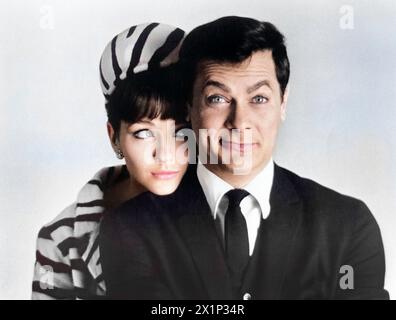 Christine Kaufmann, Tony Curtis, publicity portrait for the film, 'Wild And Wonderful' Universal Pictures, 1964 Stock Photo