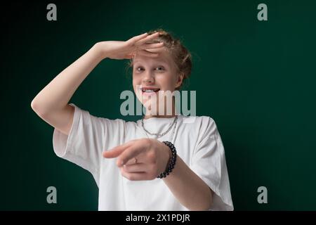 Young Woman Pointing at Something Stock Photo