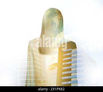 Double exposure of businesswoman and cityscape with office buildings Stock Photo