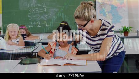 In school, a Caucasian mentor helping a diverse group of young students Stock Photo