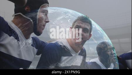 Group of friends playing bubble soccer, Caucasian man in focus Stock Photo