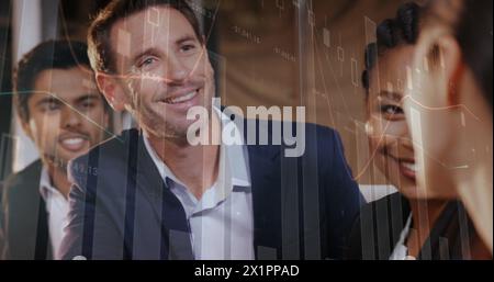 Diverse group of colleagues analyzing data on screen, sharing ideas Stock Photo